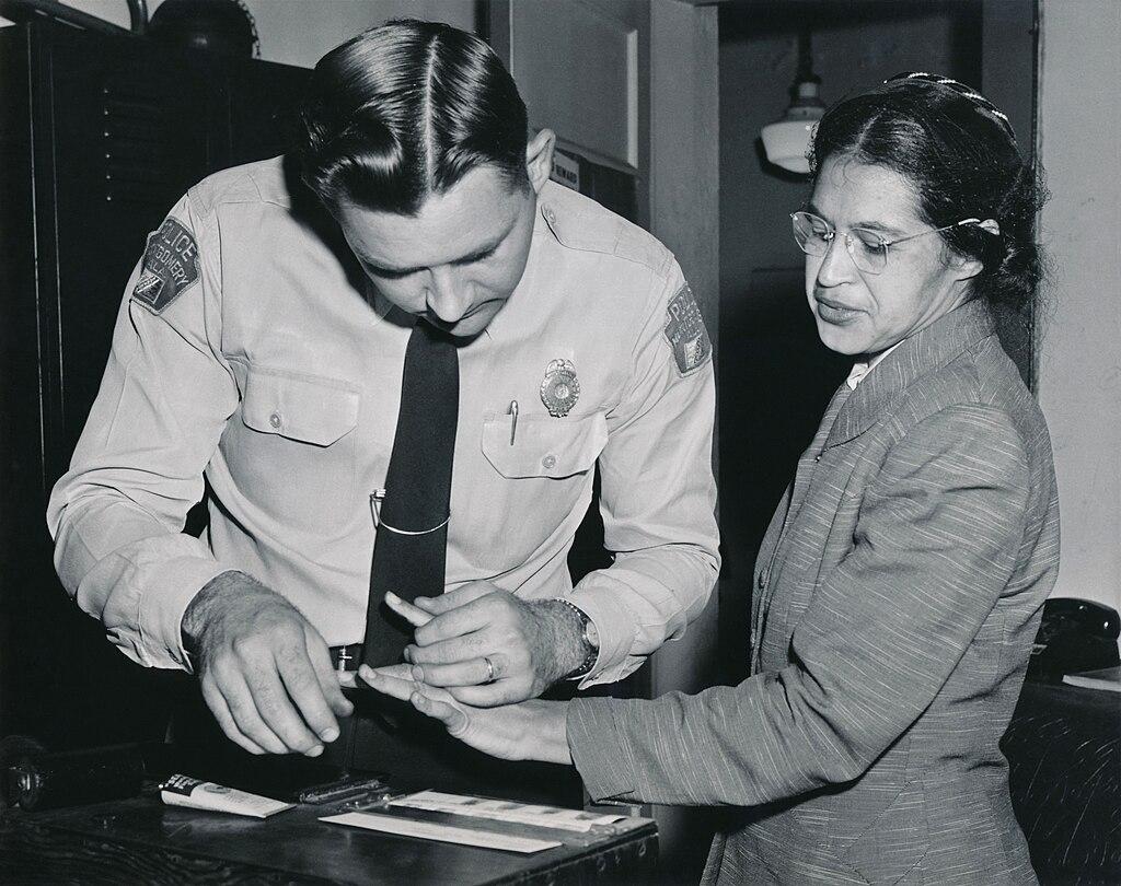 Moment image for Rosa Park's bus protest initiates Montgomery Bus Boycott, inspiring civil rights movement.