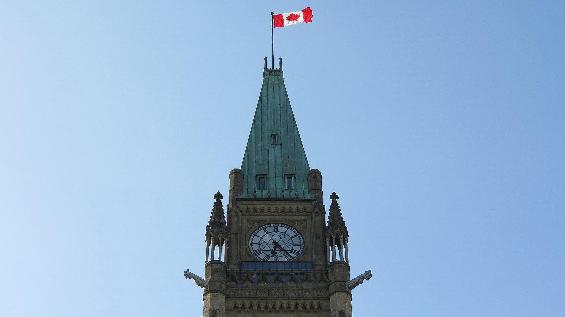 Moment image for Canadian Parliament adopts new national flag design featuring red maple leaf symbol.