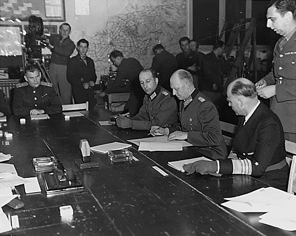 Moment image for Berlin signs second surrender agreement resembling the first.