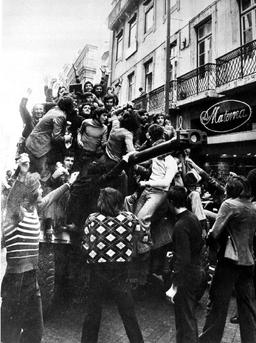 Carnation Revolution ends dictatorship, grants independence to African colonies, transitions Portugal to democracy.