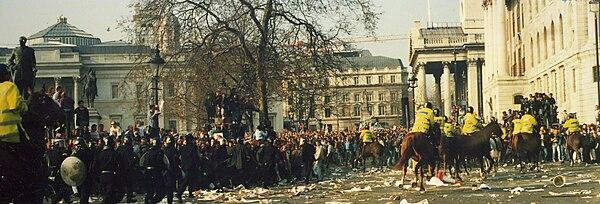 Moment image for Violent protests in London against controversial Poll Tax, leading to widespread chaos and unrest.