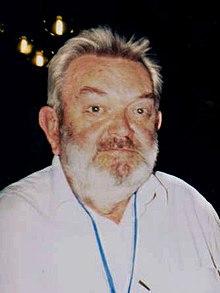 Moment image for Nobel laureates in Physics for work on electroweak interactions and Standard Model advancements.