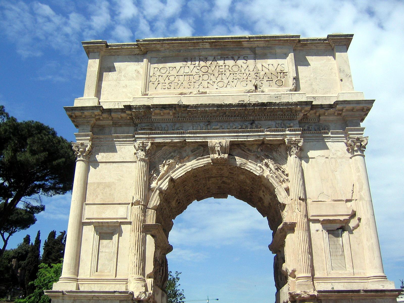 Moment image for Roman Emperor Trajan's triumphal arch in Carthage honors victory over the Dacians in war.
