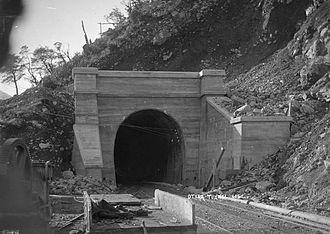 Moment image for Completion of Otira Tunnel: Christchurch-Greymouth line now connected.