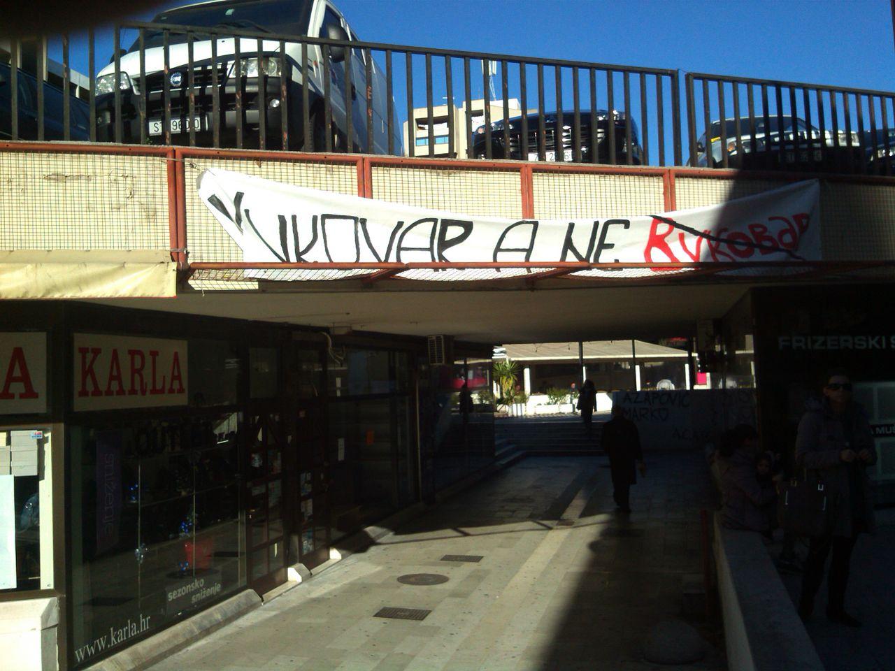 Moment image for Protests in Vukovar against the use of Cyrillic script escalate tensions in the region.