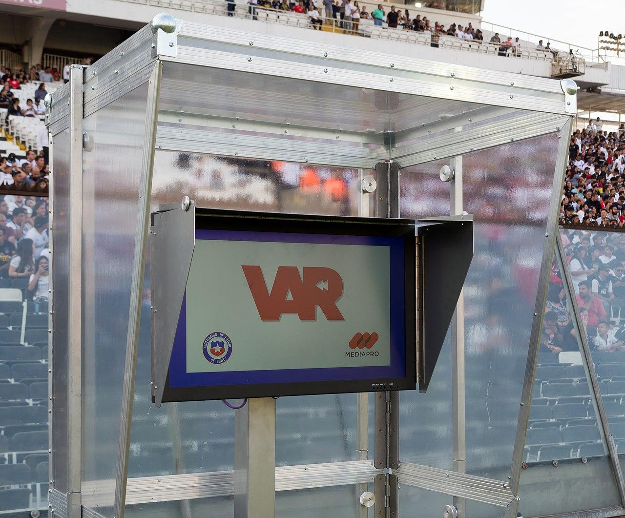 Moment image for VAR now fully incorporated in football matches, impacting decisions and controversies in the games.