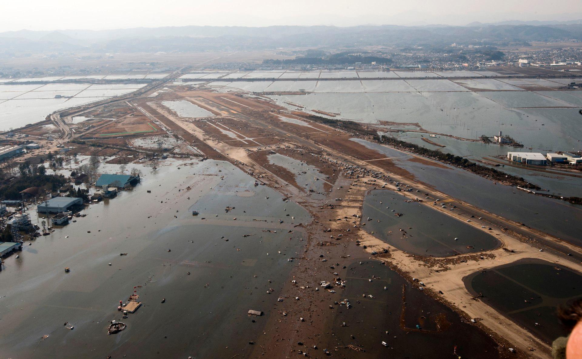 Moment image for The devastating impact of a powerful earthquake and tsunami.