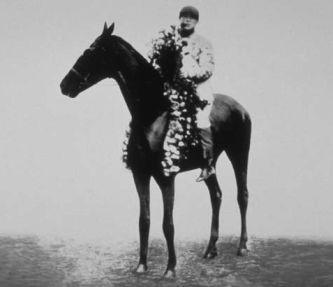 Moment image for Worth wins on muddy track in 2:09.4 with jockey Carroll Shilling and trainer Frank Taylor.