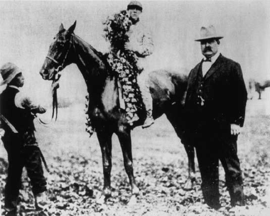 Moment image for Stone Street triumphs in heavy conditions with jockey Pickens, trainer Hall and owners Hamilton.