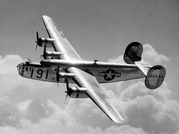 Begins production of military vehicles for WWII; Willow Run plant produces B-24 bombers.