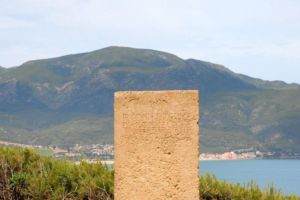 Moment image for Stele in Tipasa honors Albert Camus, reflecting his philosophical connection to the site.