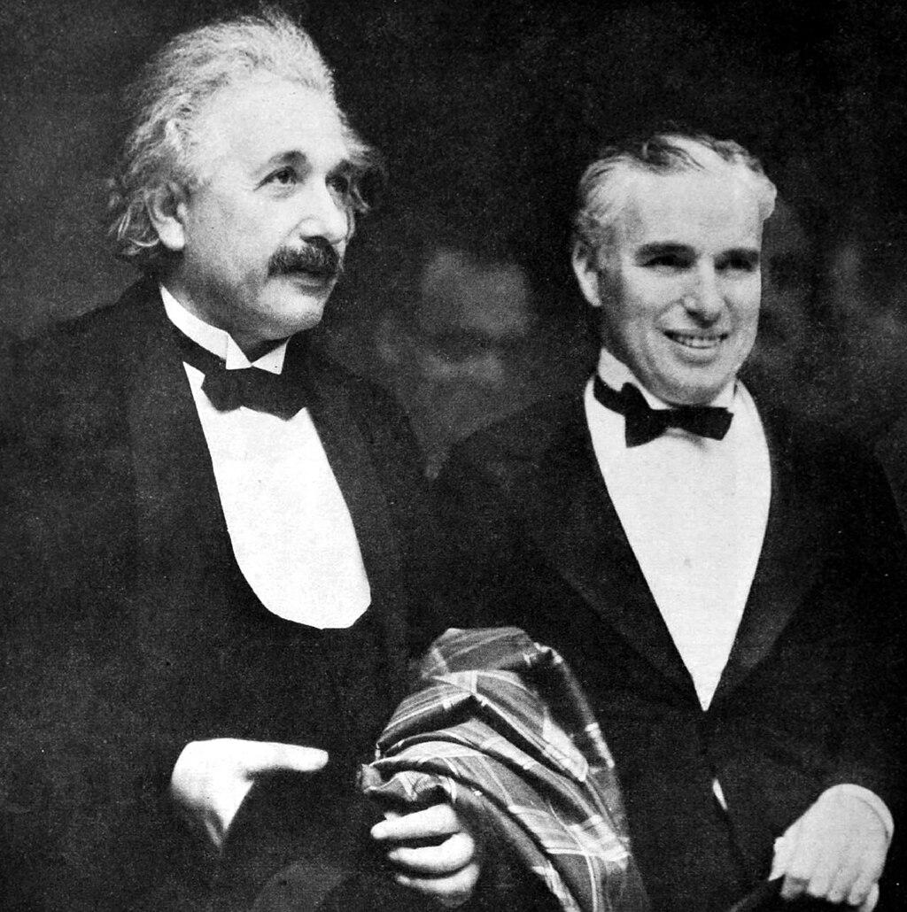 Moment image for Einstein and Chaplin unite at "City Lights" premiere: Fusion of science and entertainment.