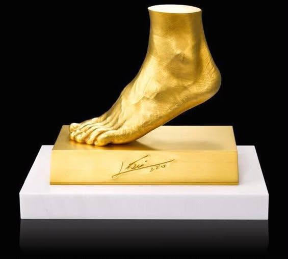 Moment image for Gold Replica of Messi's Foot Sold for Charity