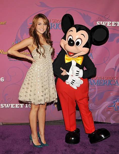 Moment image for Disney's $1M donation to Youth Service America at Miley Cyrus's Disneyland birthday promotes youth involvement.