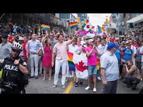 Moment image for Justin Trudeau joins Pride parade as first sitting Prime Minister, promoting inclusivity and support.
