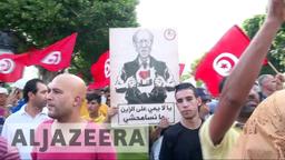 Controversial law grants amnesty to corrupt officials from Tunisia's past regime.