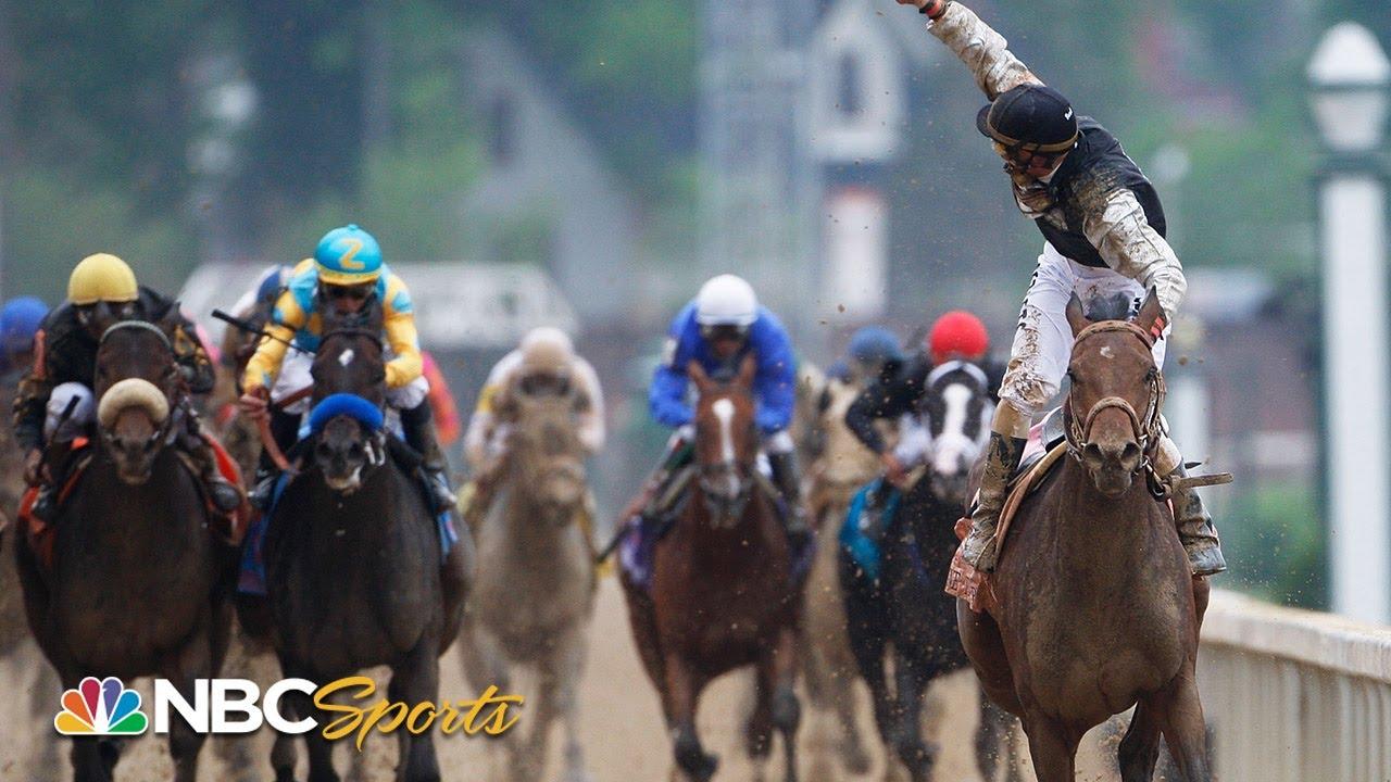 Moment image for Mine That Bird wins with jockey Borel, trainer Woolley Jr. Track was sloppy, time 2:02.66.