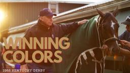 Winning Colors triumphs under Gary Stevens in 1+1/4-mile race at fast track, 2:02.2.