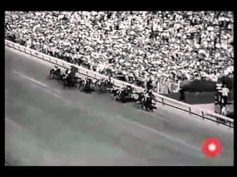 Moment image for Lucky Debonair's victory at 1 1/4 miles in 2:01.2 on a fast track.