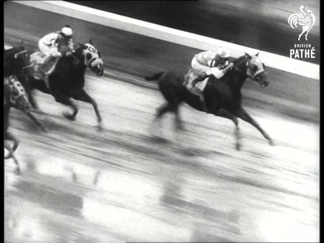 Moment image for Carry Back wins with jockey Johnny Sellers at 1+1⁄4 miles in 2:04.0 on a good track.