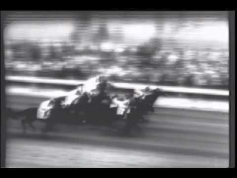 Moment image for Iron Liege triumphs at historic event with Bill Hartack riding, owned by Calumet Farm.