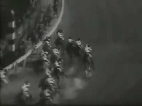 Moment image for War Admiral wins 1+1⁄4 miles race on fast track in 2:03.2, with Charley Kurtsinger riding.