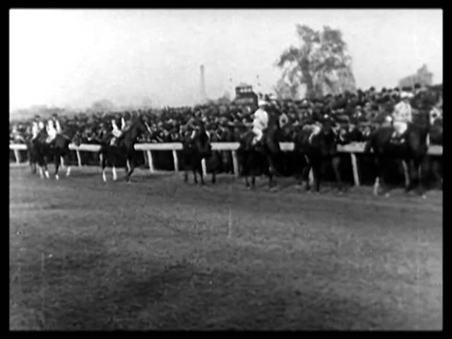 Moment image for Paul Jones, ridden by Ted Rice, wins the race in 2:09.0 on a slow track.