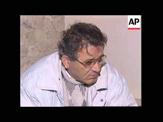 Moment image for Sali Berisha resigns following financial crisis, Rexhep Mejdani becomes president.