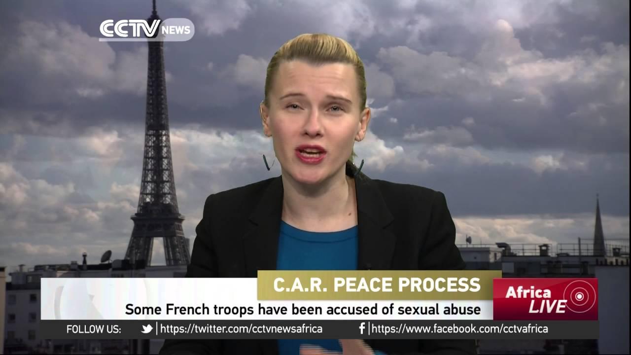 Moment image for France starts withdrawal; African peacekeepers take over from French troops.