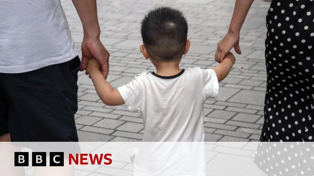 Moment image for China bans overseas adoption of children