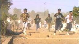 Pro-independence demonstrators shot at Santa Cruz cemetery during massacre.