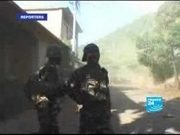 AU and Comoran troops recapture Anjouan; France detains leader Mohamed Bacar.