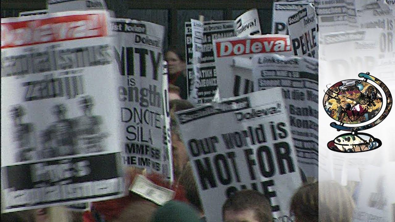 Moment image for Mass protests and journalist strike oust television director after Communism.