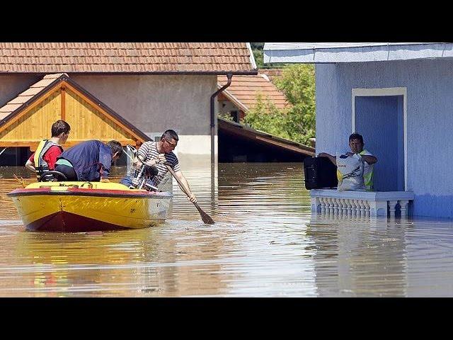 Moment image for Devastating flooding displaces thousands in Bosnia.