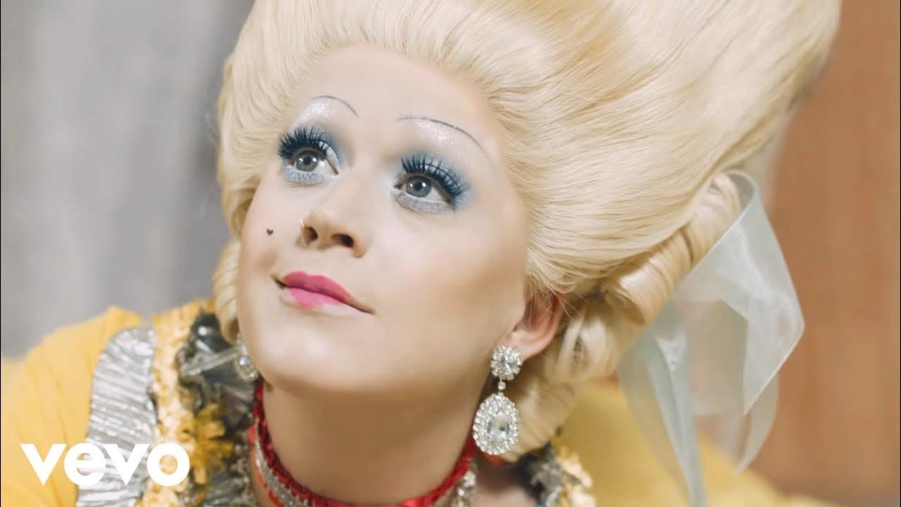 Moment image for "Hey Hey Hey" music video embodies empowerment through dual historical portrayals.