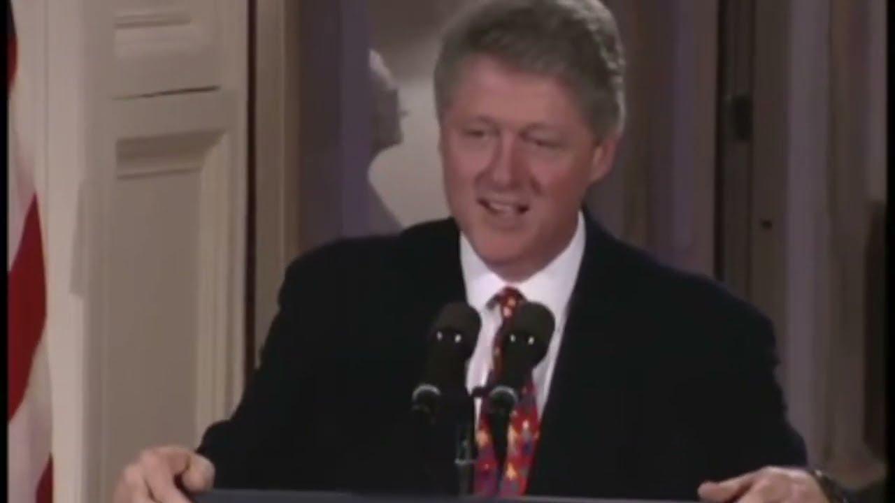 Moment image for Bill Clinton signs Brady Act for firearm background checks.