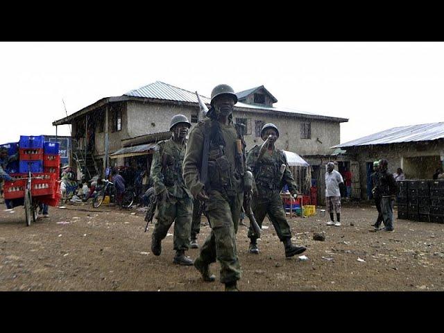 Moment image for Combat troops patrol in Kinshasa after failed coup attempt