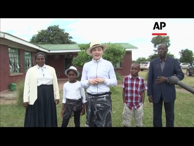 Moment image for Madonna Adopts Twin Sisters From Malawi