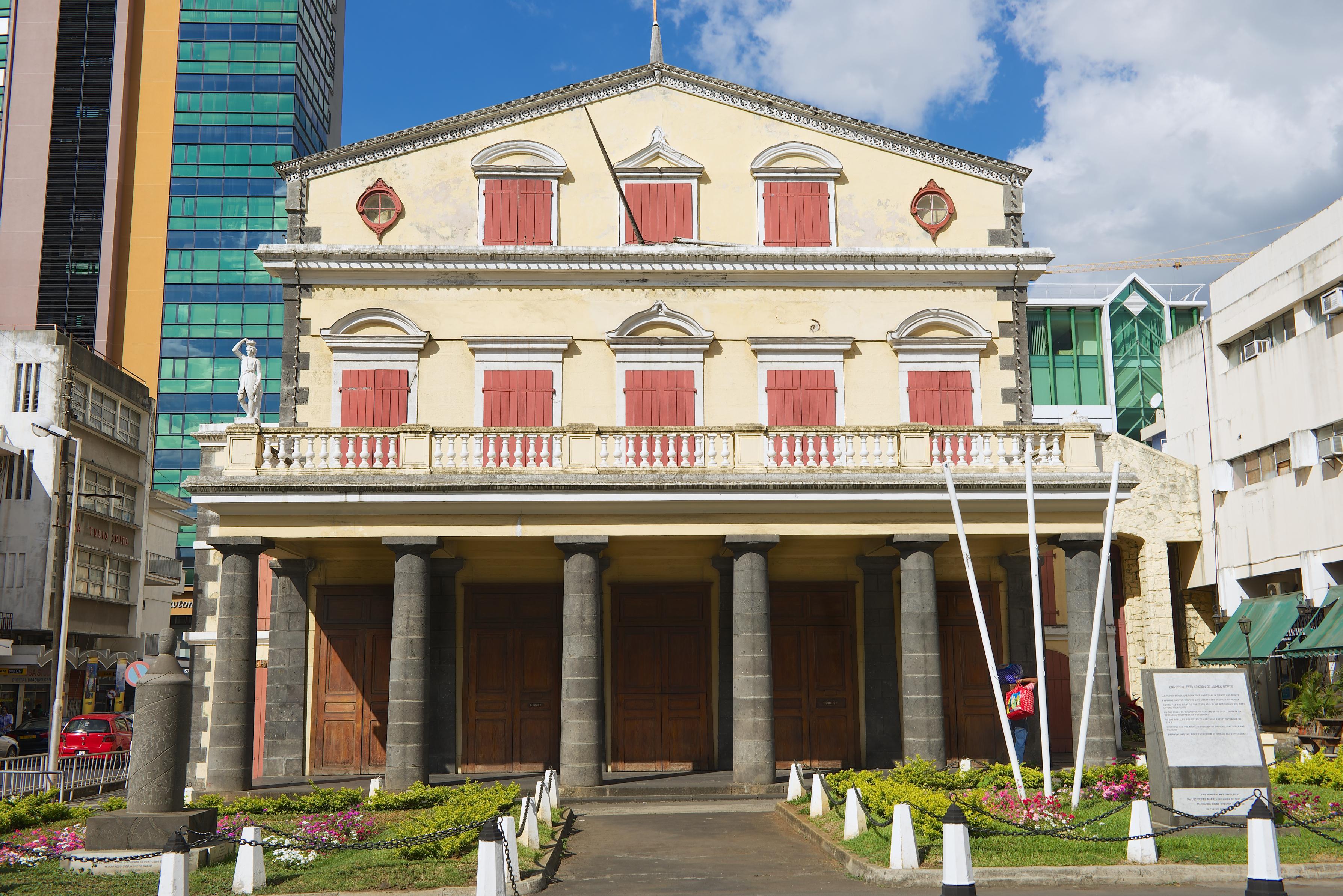 Moment image for Inauguration of the Port Louis Theatre in a celebratory event attended by dignitaries and performers.