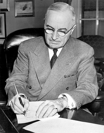 Moment image for Truman Doctrine provided aid to countries threatened by communism, marking start of Cold War.