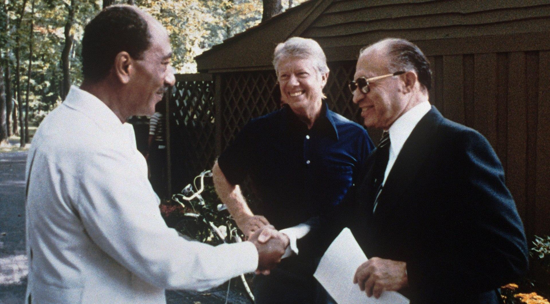 Moment image for Camp David Accords: Sadat and Begin sign peace agreement.