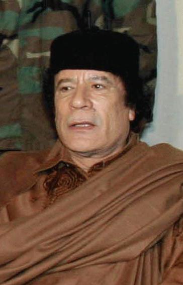 Moment image for Gaddafi renounces weapons programs to improve relations with the West.