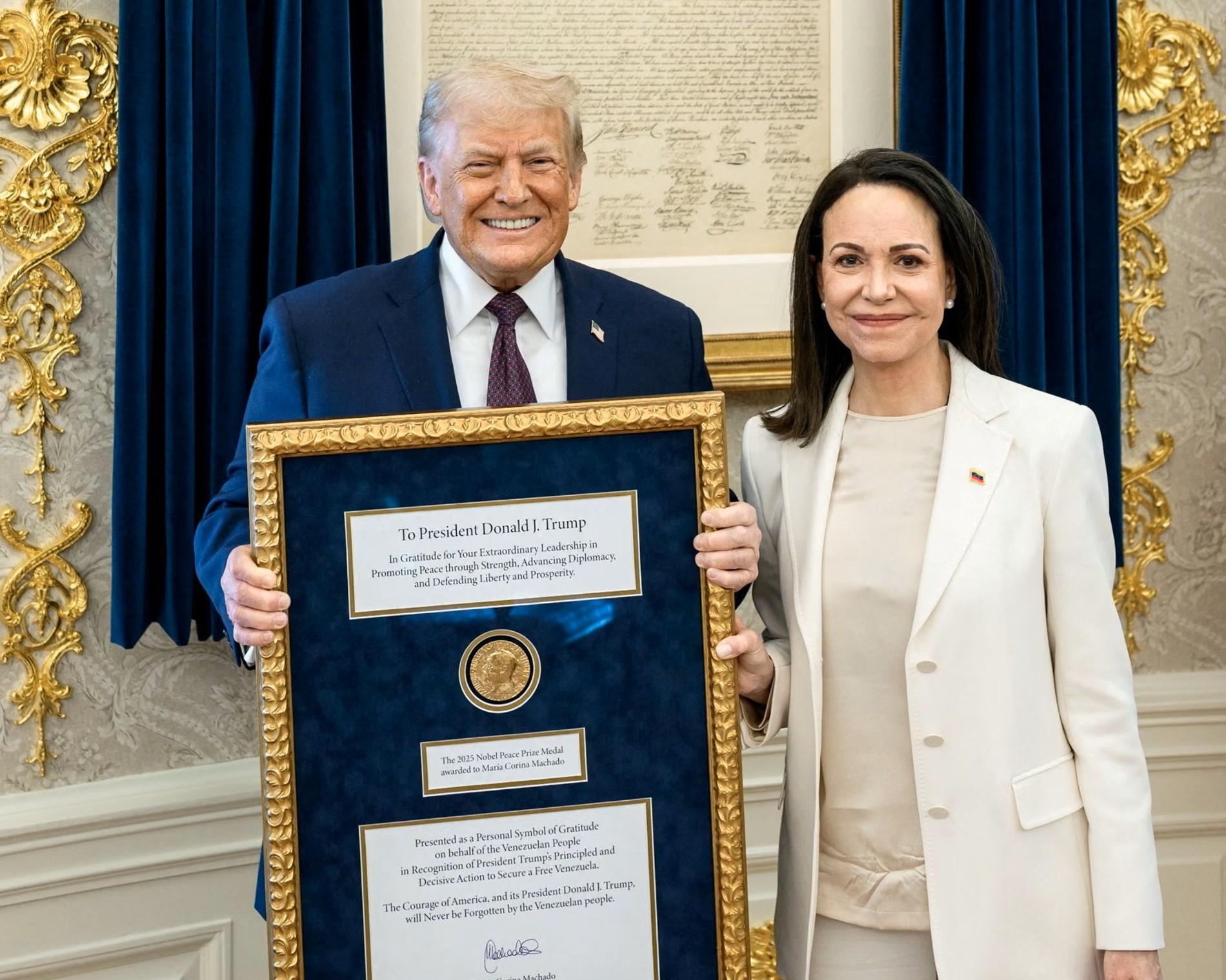 Moment image for María Corina Machado gives her Nobel Peace Prize medal to President Donald Trump