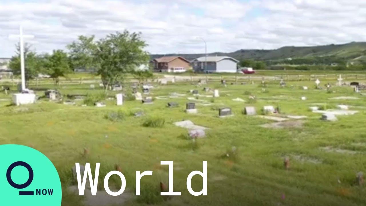Moment image for Indigenous children's unmarked graves found at residential schools prompt national reflection and reckoning.
