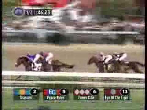Moment image for Funny Cide's victory under José Santos in 1+1⁄4 miles race at fast track.