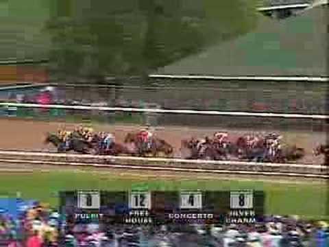 Moment image for Silver Charm wins under jockey Gary Stevens, trained by Bob Baffert on fast track.