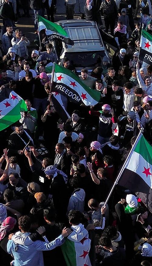 Moment image for Opposition forces topple Bashar al-Assad’s government as celebrations sweep Syria, including Homs